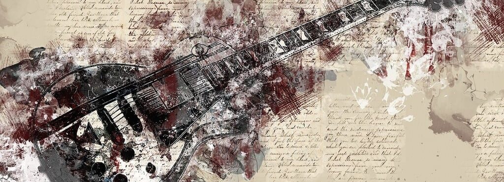 An image of creativity showing a les paul guitar with artistic painting and cursive writing.